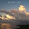 long string of little clouds just above horizon